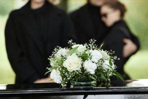 Close up of flower bouquet on coffin